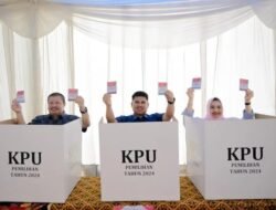 Bupati Bengkalis dan Keluarga Nyoblos di TPS 03 Muara Basung
